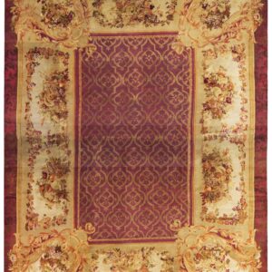 Traditional rug with a burgundy medallion center, framed by elaborate cream and gold floral scrollwork borders.