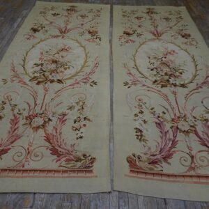 Matching pale green low-pile panels with ornate pink floral, scroll, and dolphin patterns on wood planks.