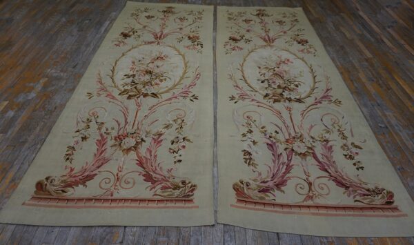 Matching pale green low-pile panels with ornate pink floral, scroll, and dolphin patterns on wood planks.