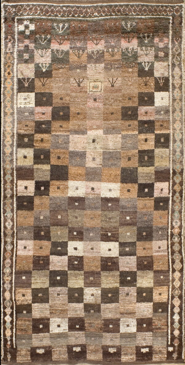 Rustic high-pile rug displays a muted brown and tan checkerboard pattern with subtle geometric borders.