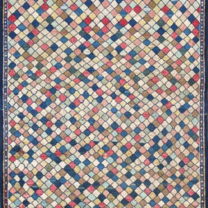 A polychromatic rug featuring a dense diamond lattice pattern framed by a wide, solid navy blue border.