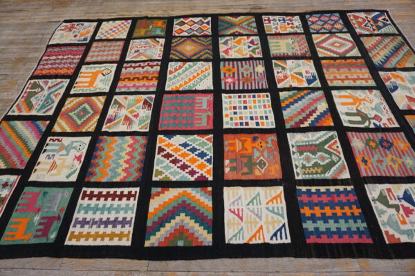 Flatwoven rug featuring a grid of diverse colorful geometric and figural patches on wooden flooring.