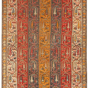 A richly patterned runner rug featuring vertical stripes of red, blue, and gold with geometric medallions.