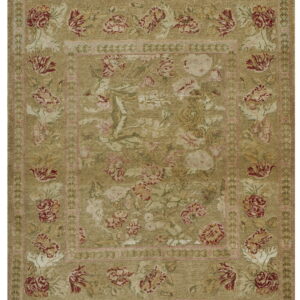 Traditional low-pile rug featuring red, pink, and cream florals on a distressed olive green field.
