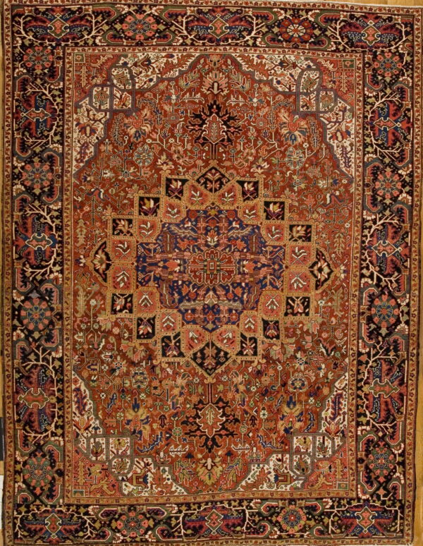 Traditional low-pile rug in terracotta red featuring an intricate stepped medallion and dense floral-geometric patterns.