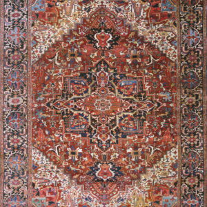 Highly detailed rug displaying a large geometric medallion pattern in deep red, black, blue, and cream colors.