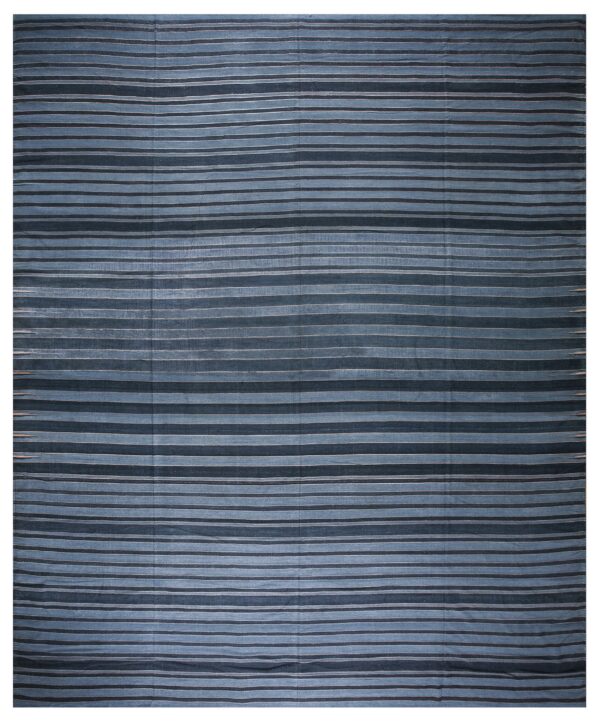 Blue rug featuring woven horizontal stripes in alternating dark and dusty blue hues.