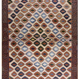 Flatwoven rug in cream, rust, and multi-blue geometric diamonds framed by a Greek Key border.