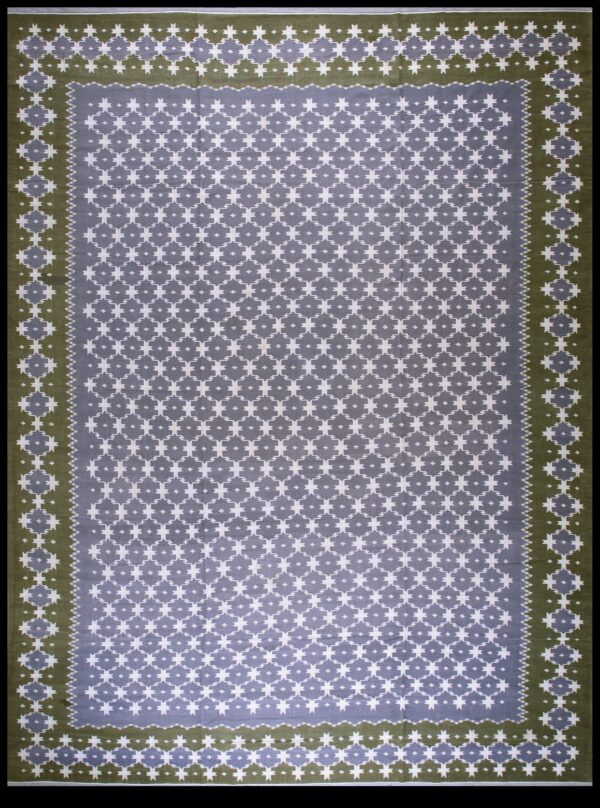 Low-pile rug with repeating white and gray geometric stars and a wide olive green border.