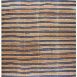 A flatwoven rug featuring wide horizontal stripes of golden tan and faded navy blue.
