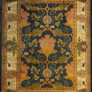 Navy, rust, and gold patterned rug featuring a stylized floral tree design and a wide cream border.