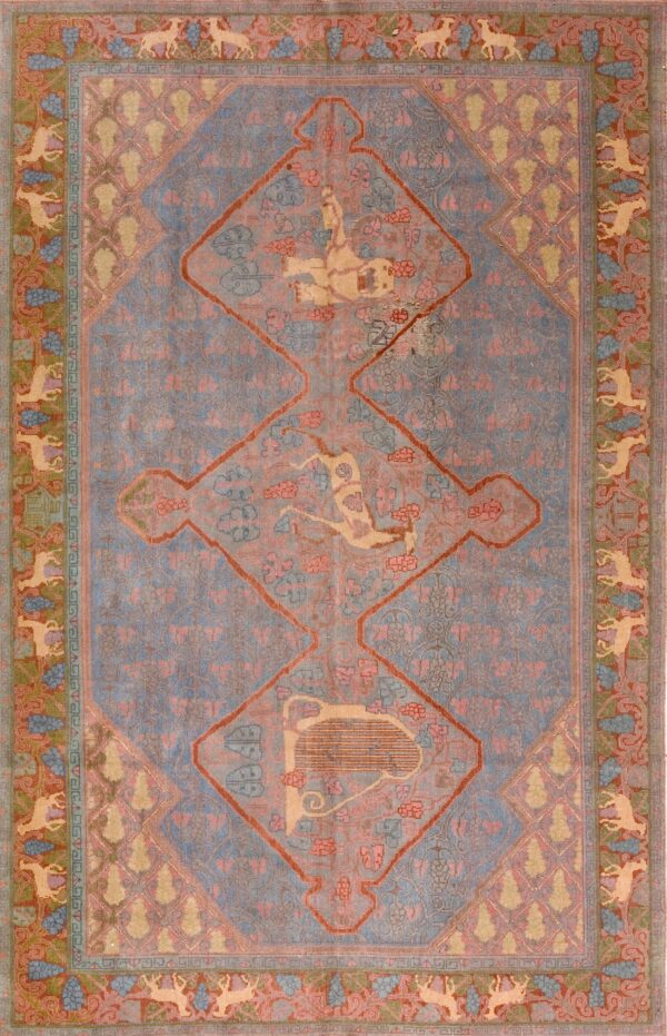 A muted gray-blue rug features a central diamond medallion with a stylized gold harp and pink floral patterns.