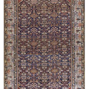 Dark navy rug with intricate red and ivory floral lattice patterns and a wide patterned cream border.