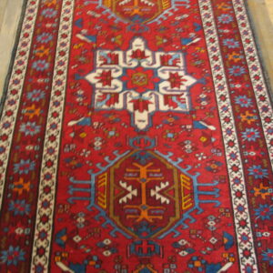 Detailed view of the coral wool pile on a Karajeh hallway runner