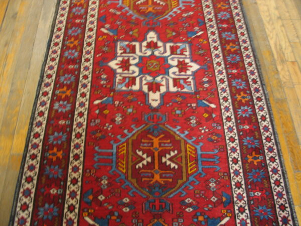 Detailed view of the coral wool pile on a karajeh hallway runner