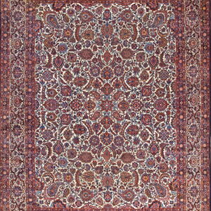 Ivory rug with a dense traditional pattern of red, rust, and blue floral motifs and a detailed border.