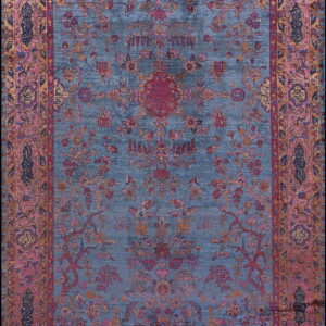 Slate blue rug with a complex traditional floral pattern outlined in pink, red, and gold.