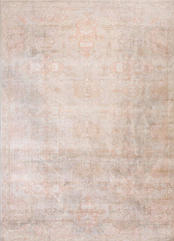 A distressed area rug featuring a traditional ornate pattern in pale pink, cream, and muted gray colors.