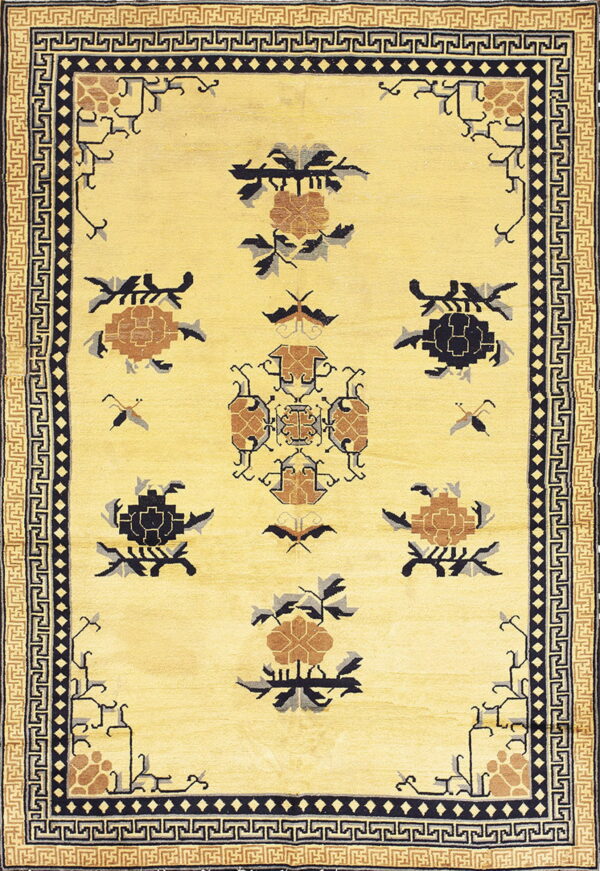 A pale yellow rug featuring stylized black and brown floral and geometric patterns with multiple key borders.