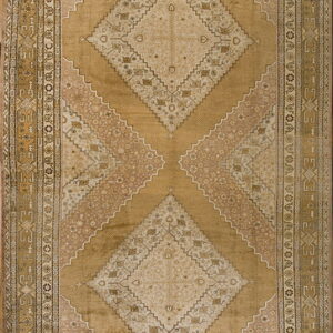 Golden brown rug with large central geometric diamond medallions and an ornate patterned border.