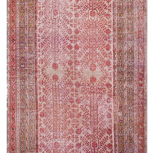 Muted red and beige rug displaying a detailed, repeating pattern of geometric and stylized tree motifs.