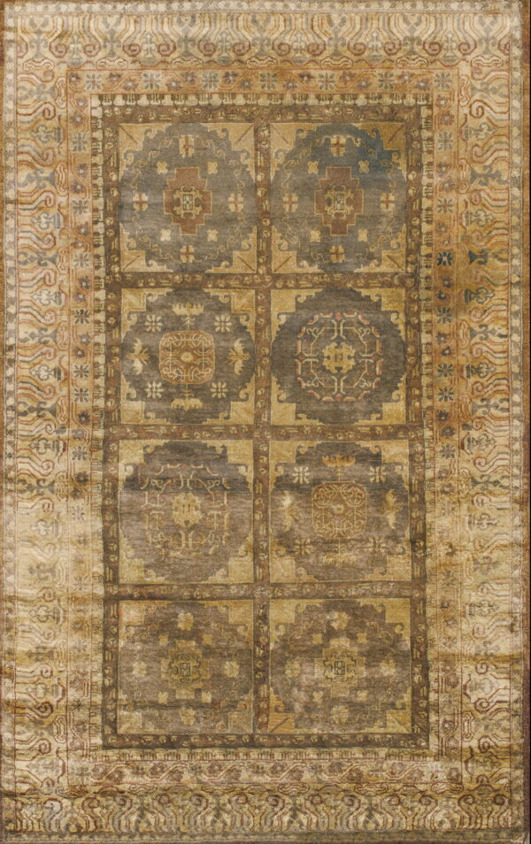 Geometric grid rug in muted tones of gold, dark gray, and brown with highly detailed patterned borders.