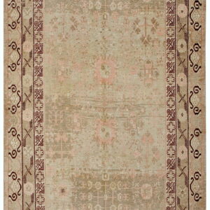 Distressed geometric rug in muted green, taupe, and blush with intricate borders highlighted in deep burgundy.