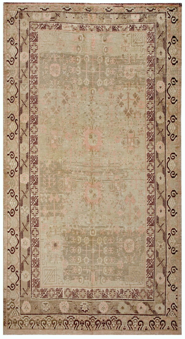 Distressed geometric rug in muted green, taupe, and blush with intricate borders highlighted in deep burgundy.