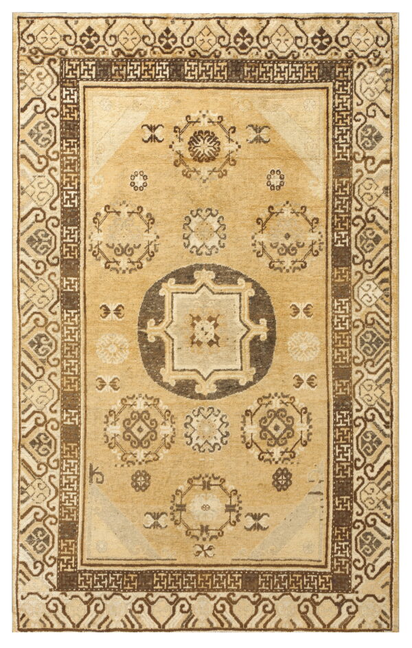 Tan rug with a dark brown central medallion and bold multi-layered geometric borders.