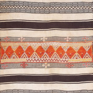A flat-woven rug with cream and dark brown horizontal stripes, featuring a central band of bright orange geometric diamond patterns.