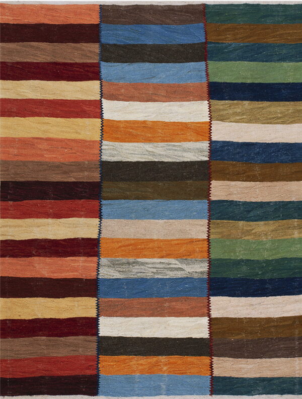 Three stitched vertical panels form a flatweave rug patterned with multi-colored horizontal stripes.