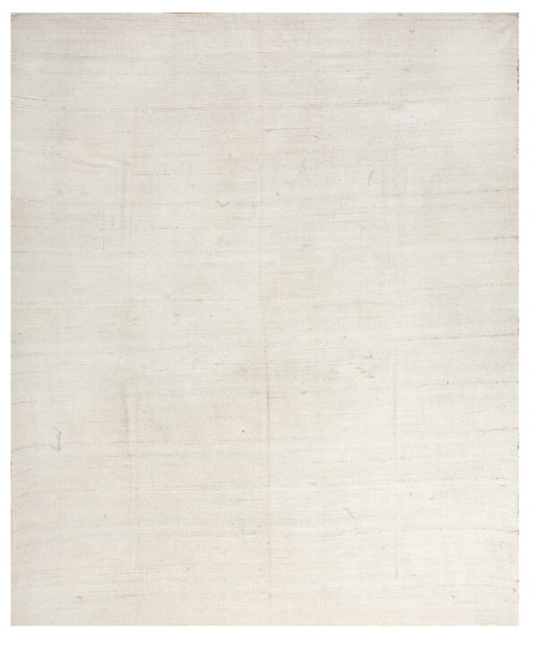 Solid cream flatweave rug displaying subtle horizontal lines and low texture.
