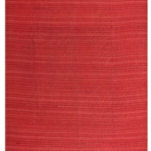 Solid reddish-pink flatweave rug with prominent horizontal striations across the surface.