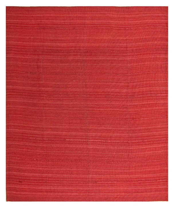 Solid reddish-pink flatweave rug with prominent horizontal striations across the surface.
