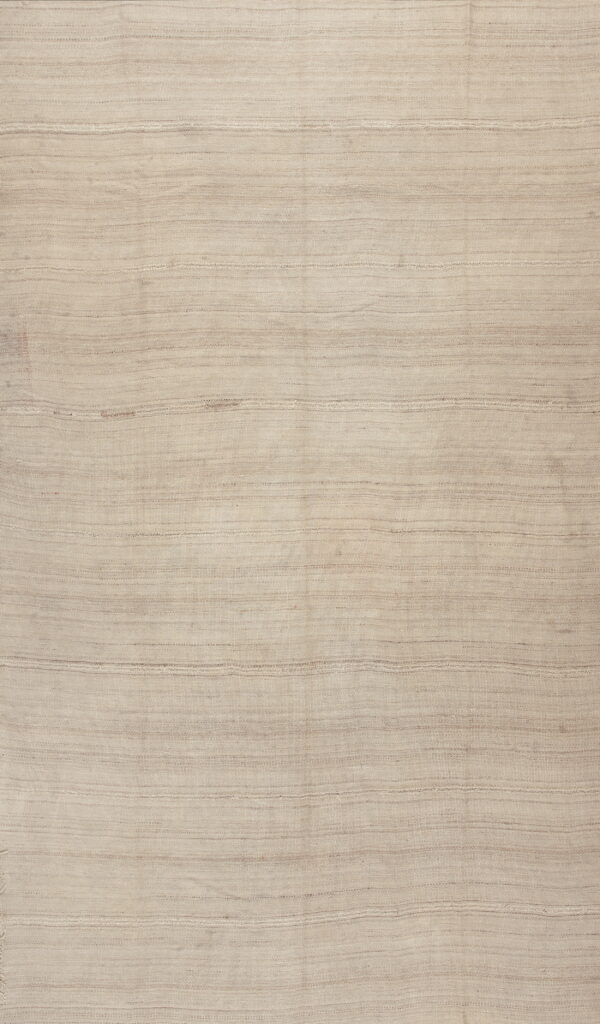 Full view of a neutral beige rug with a tight flatweave and subtle horizontal ribbed texture.