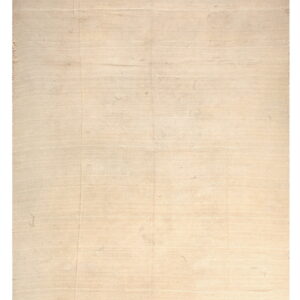 Natural off-white flatweave rug exhibiting subtle texture variations and faint horizontal seam lines.