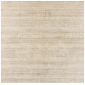 A textured light beige flatweave rug features subtle horizontal striping in varying shades of tan on a white background.