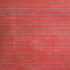 Textured coral rug with thin horizontal stripes of gray and muted blue running across the surface.