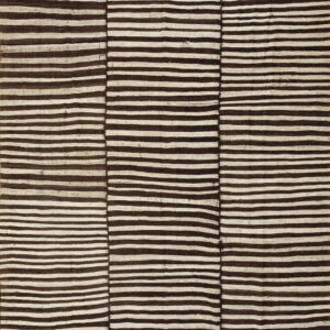 Dark brown and cream flatweave rug featuring irregular horizontal stripes across three visibly joined sections.