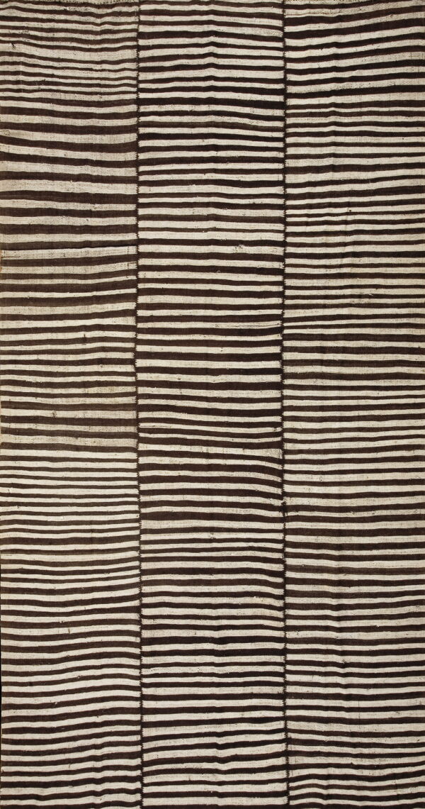 Dark brown and cream flatweave rug featuring irregular horizontal stripes across three visibly joined sections.