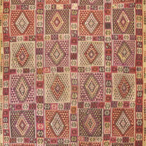 Geometric flatweave rug featuring large diamond motifs in alternating squares of red, purple, dark brown, and cream.
