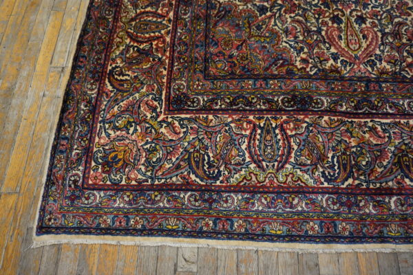 Intricate floral patterns on vintage rug