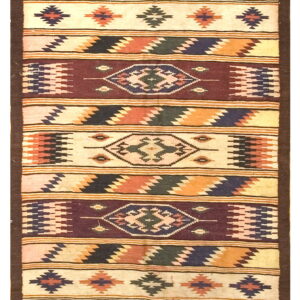 Flat-weave rug with geometric bands in cream, brown, orange, dark blue, and deep red colors.