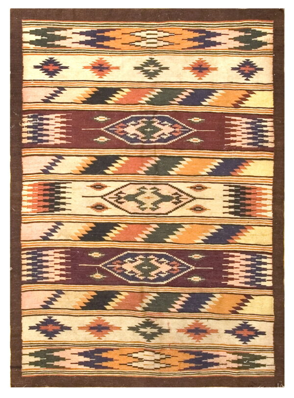 Flat-weave rug with geometric bands in cream, brown, orange, dark blue, and deep red colors.