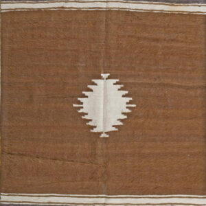 Brown shaggy rug with a white stepped center motif and horizontal gray and cream borders.