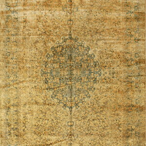 Distressed traditional rug in faded gold and amber tones with dark blue floral motifs and a center medallion.