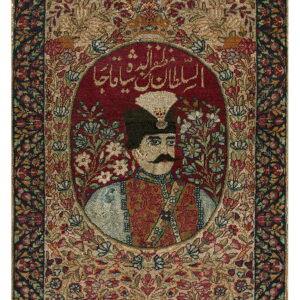 Highly detailed rug displaying a portrait in a deep red oval, framed by dense floral patterns and dark borders.