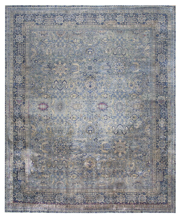 Dusty blue traditional rug with navy and cream accents, featuring a faded all-over floral pattern.