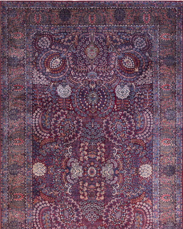 Burgundy and navy rug with an intricate, dense floral pattern and complex, multi-layered borders.