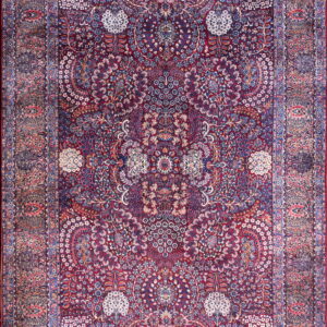 Traditional burgundy rug featuring a complex design of botanical motifs in navy blue, white, and red.
